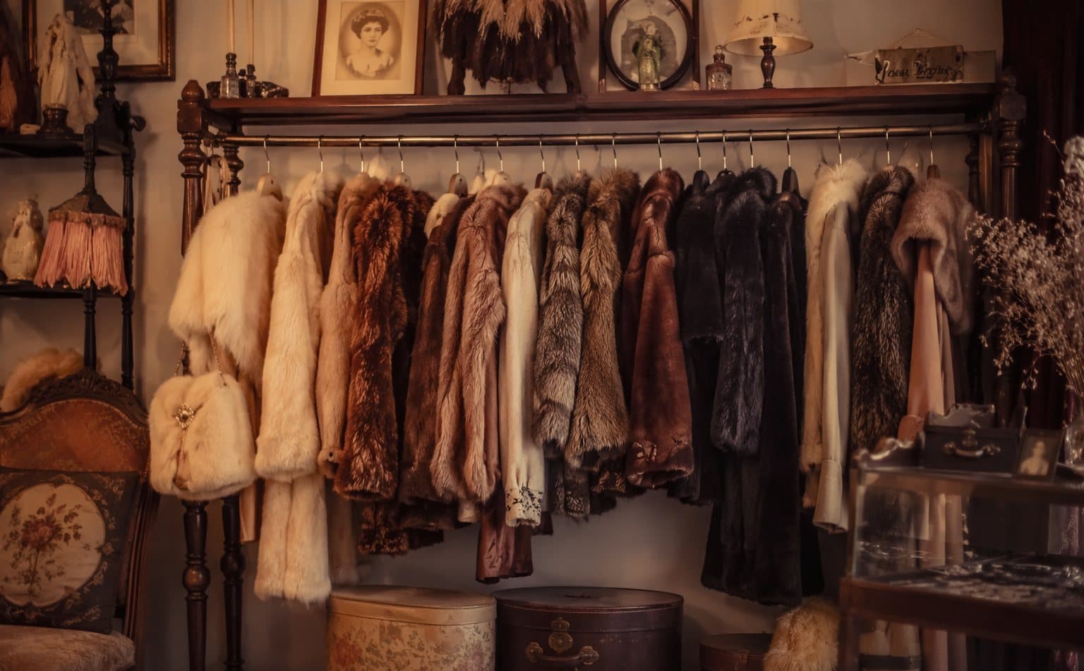 Rail of vintage fur coats inside a characterful second-hand boutique