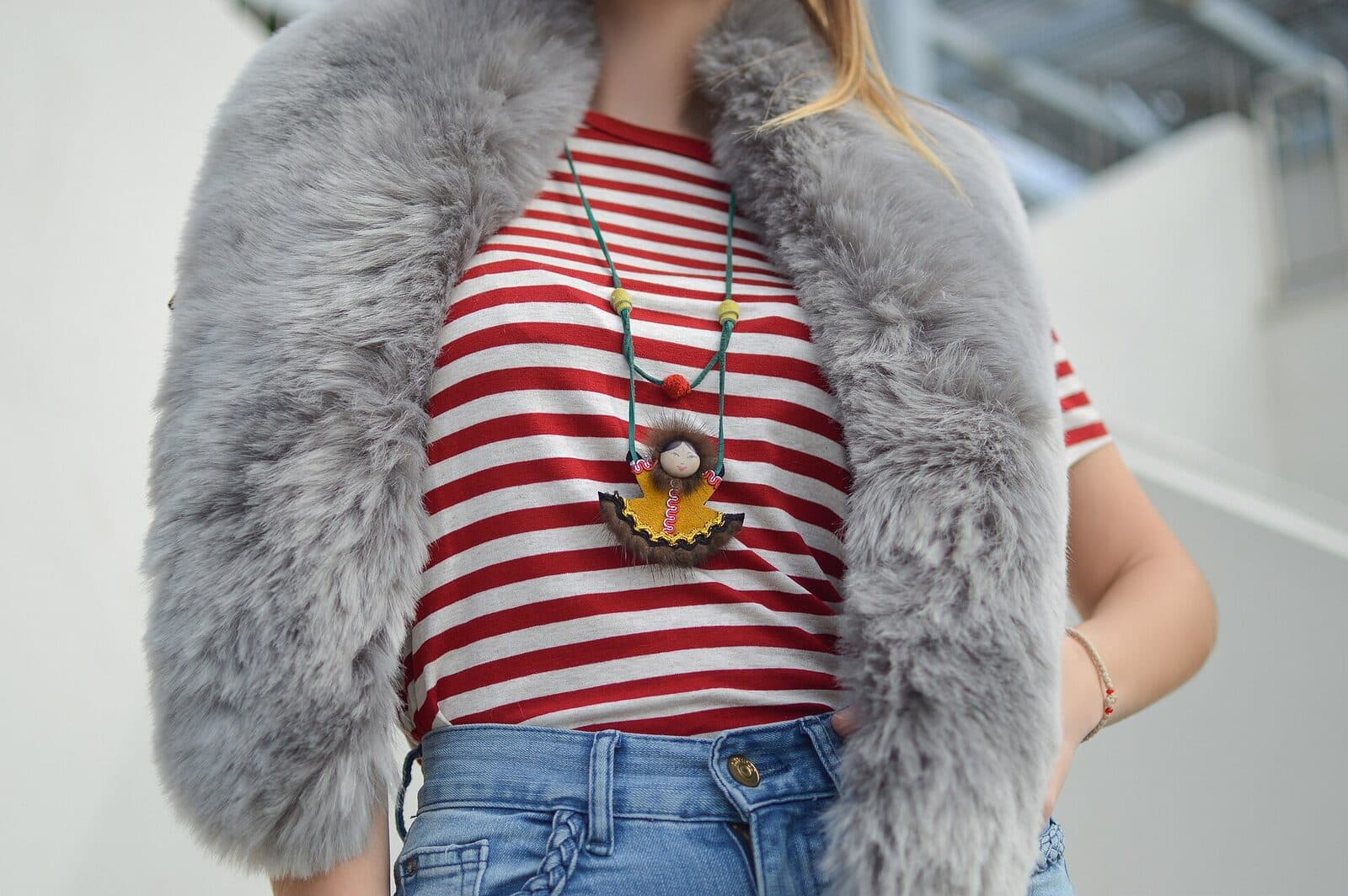 Grey faux-fur stole styled over a striped top