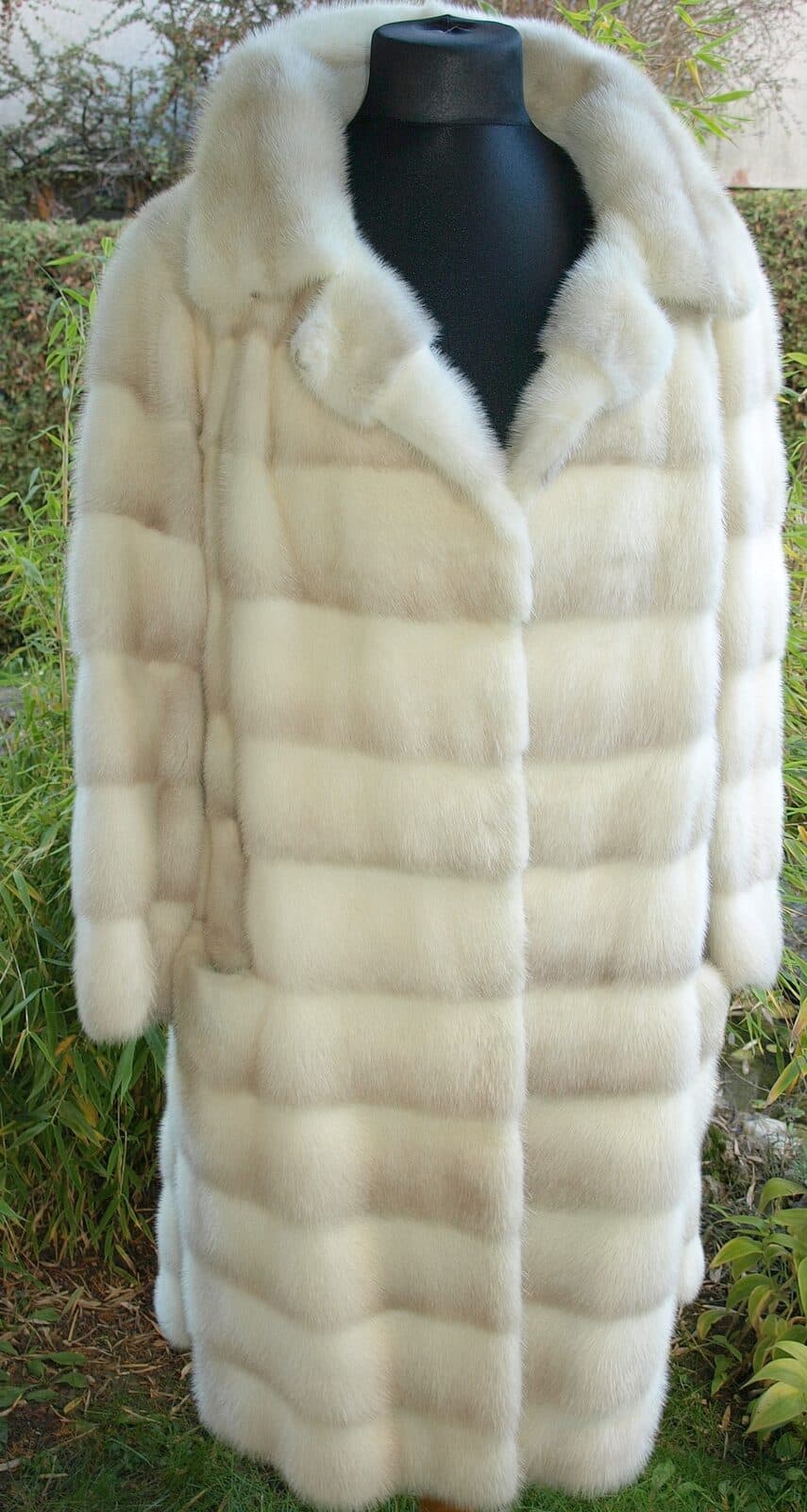 Palomino mink coat on a dress form, showing its warm honey tones